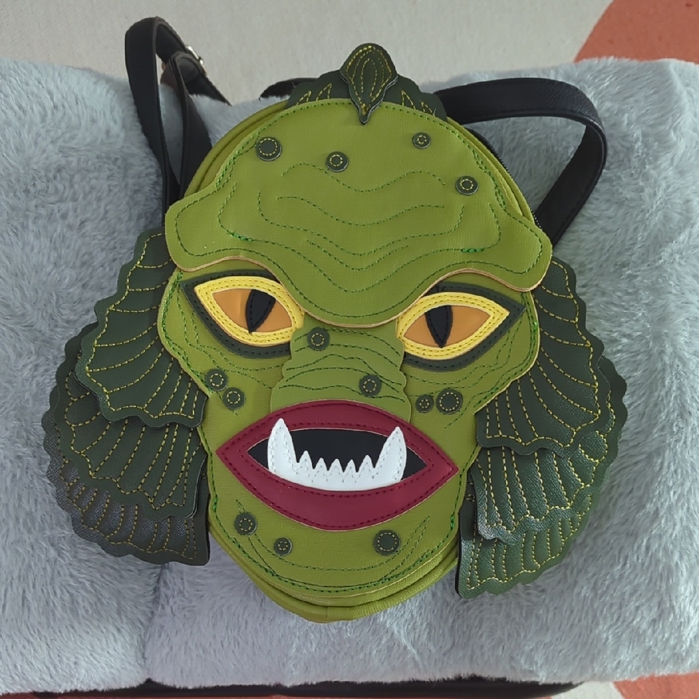 Stitches Black Backpack with Orange Label